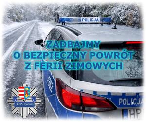 radiowóz policyjny, droga w zimowej scenerii, napis zadbajmy o bezpieczny powrót z ferii zimowych.